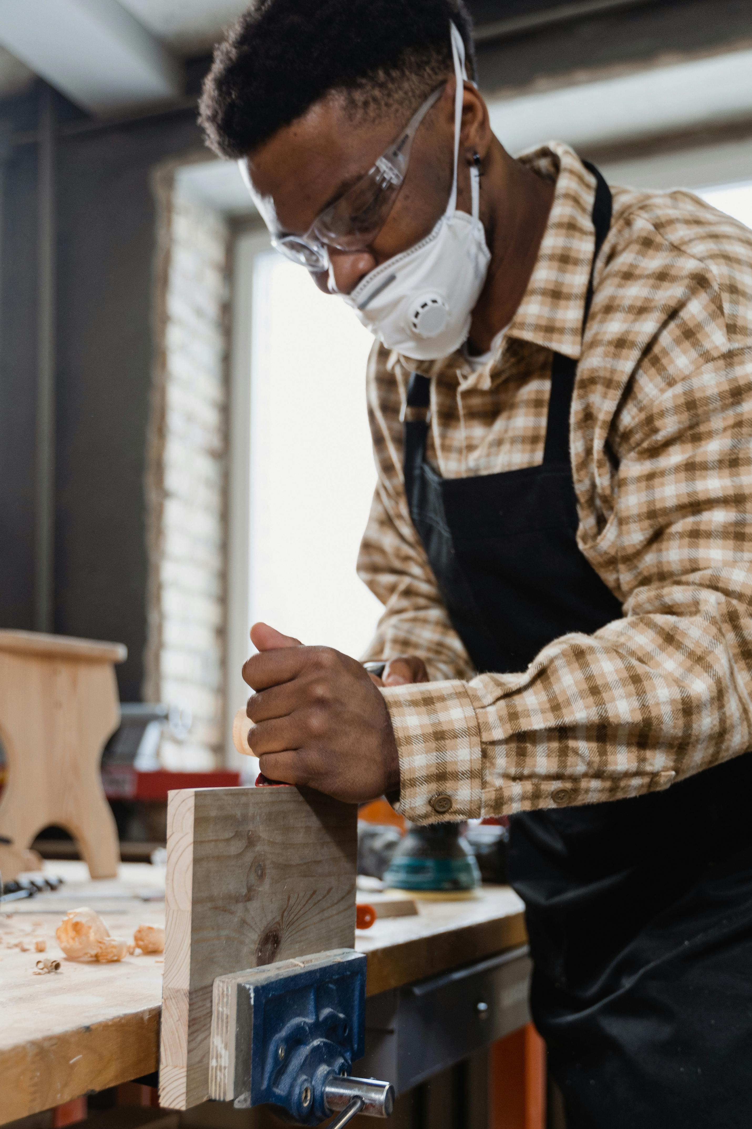 male carpenter working on wood