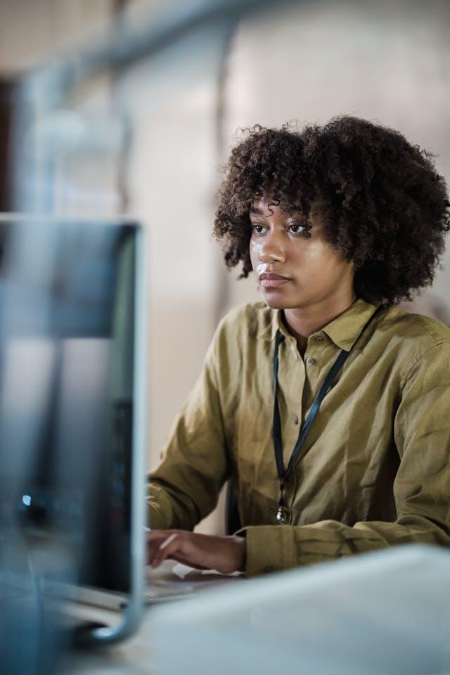 picture of black lady working on a computer