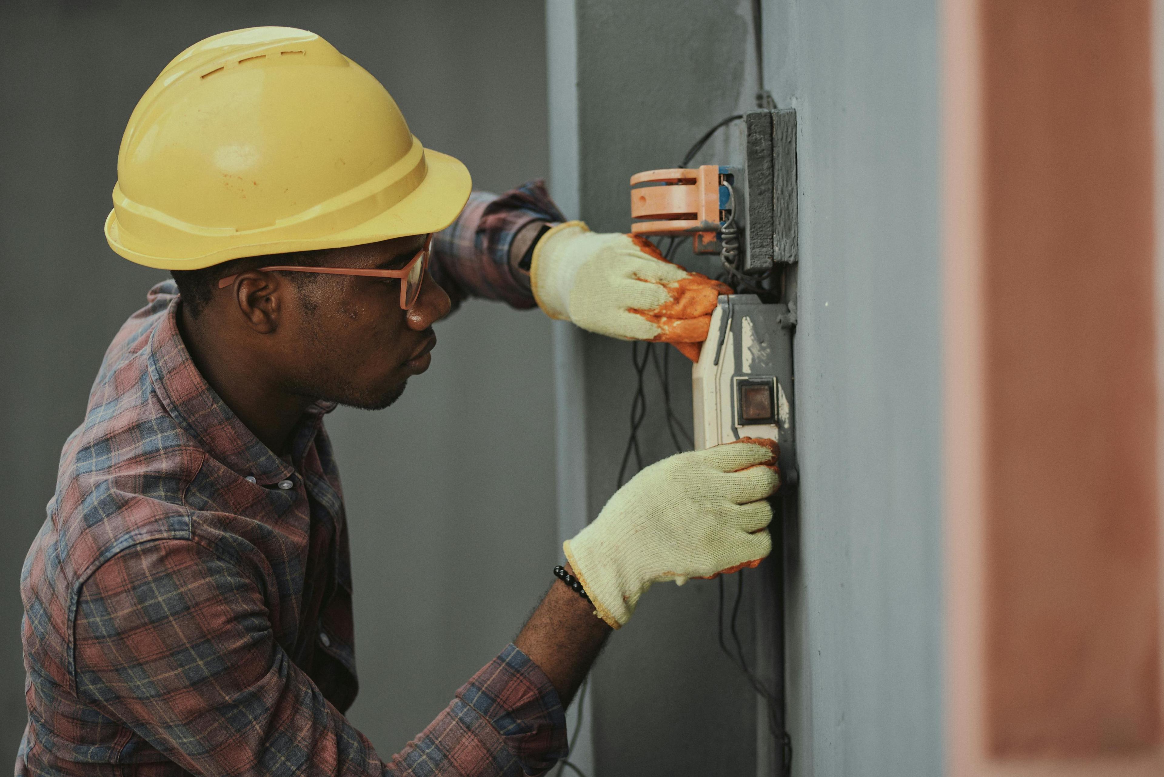 Electrician reparing a fuse box